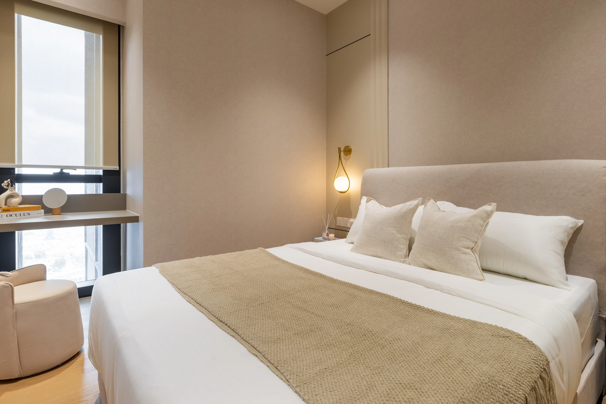 Modern bedroom interior in TRX Residences Kuala Lumpur with custom built-in carpentry, warm neutral tones and soft lighting