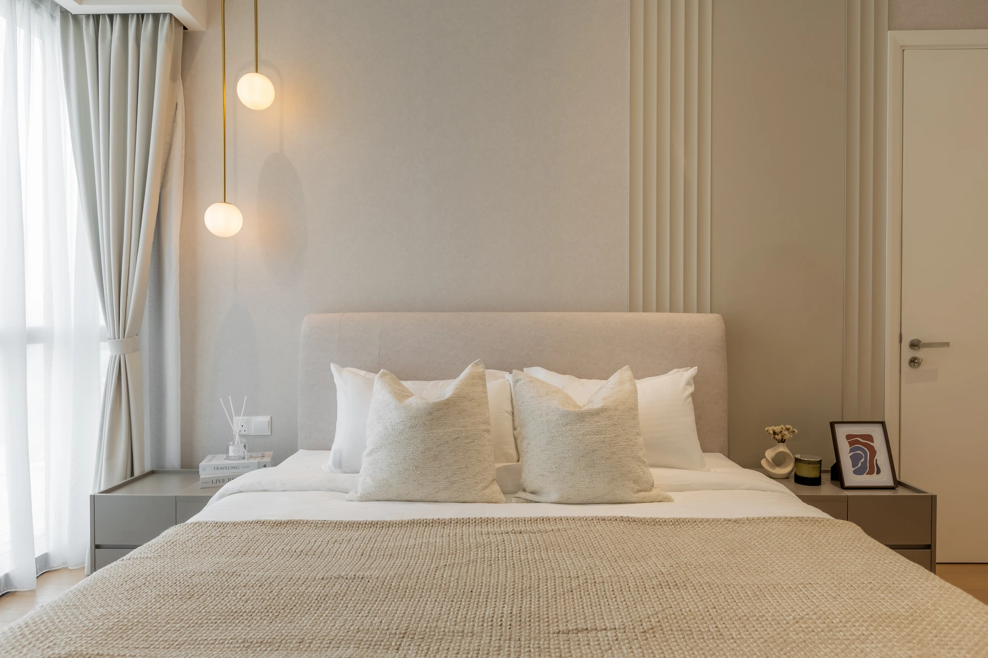 Modern master bedroom interior in TRX Residences Kuala Lumpur with custom built-in carpentry, warm neutral tones and soft lighting