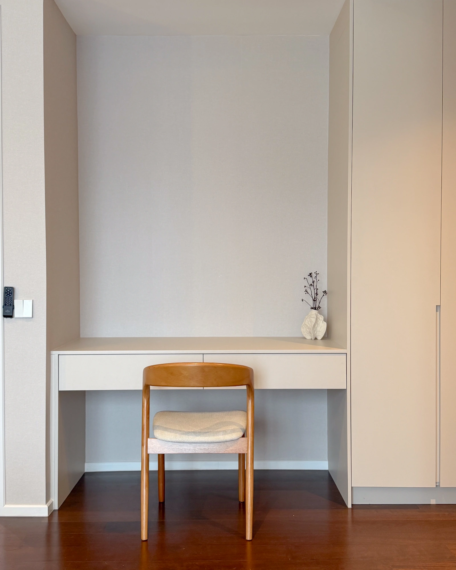 The Muji Apt bedroom study nook in Allevia, Kuala Lumpur with a built-in desk, storage cabinetry and warm neutral finishes.